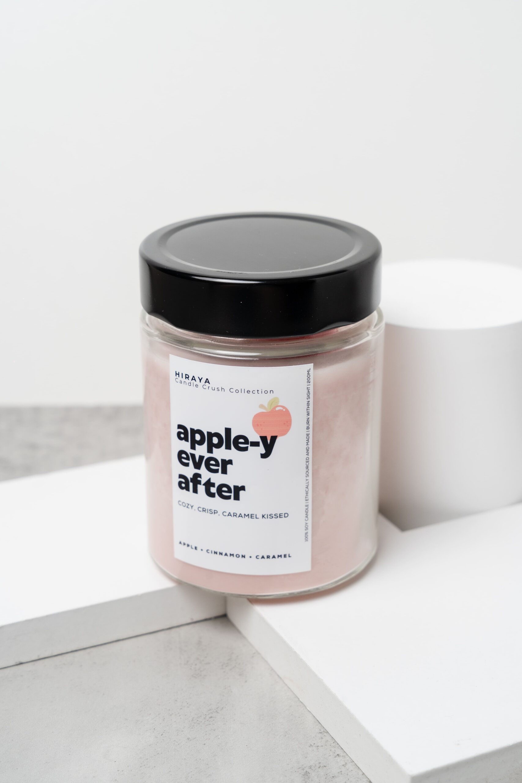 Front view of the Apple‑y Ever After candle with its warm apple‑cinnamon label in a 280ml jar.