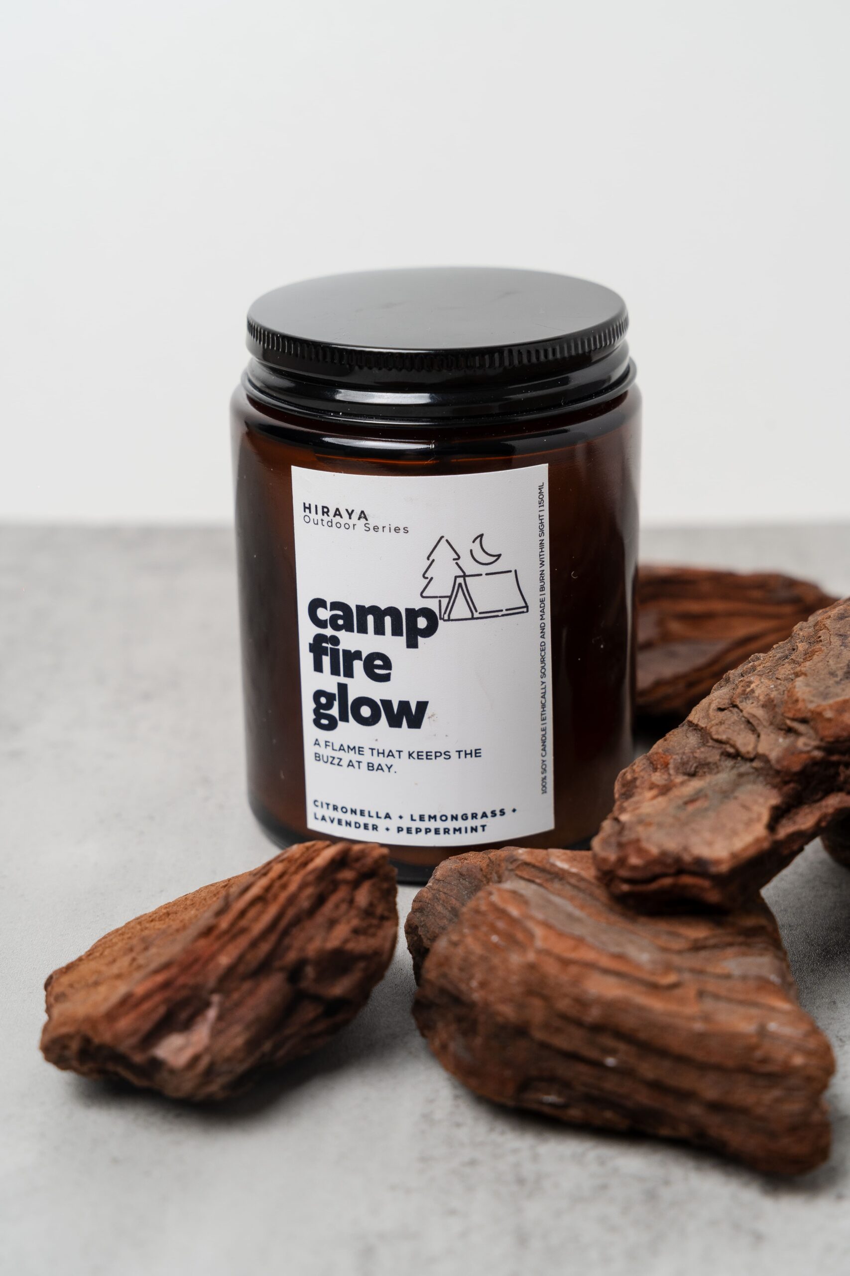 Close‑up showing wax texture and outdoor‑inspired label details.