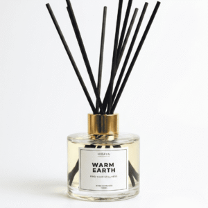 warm earth reed diffuser in white background
